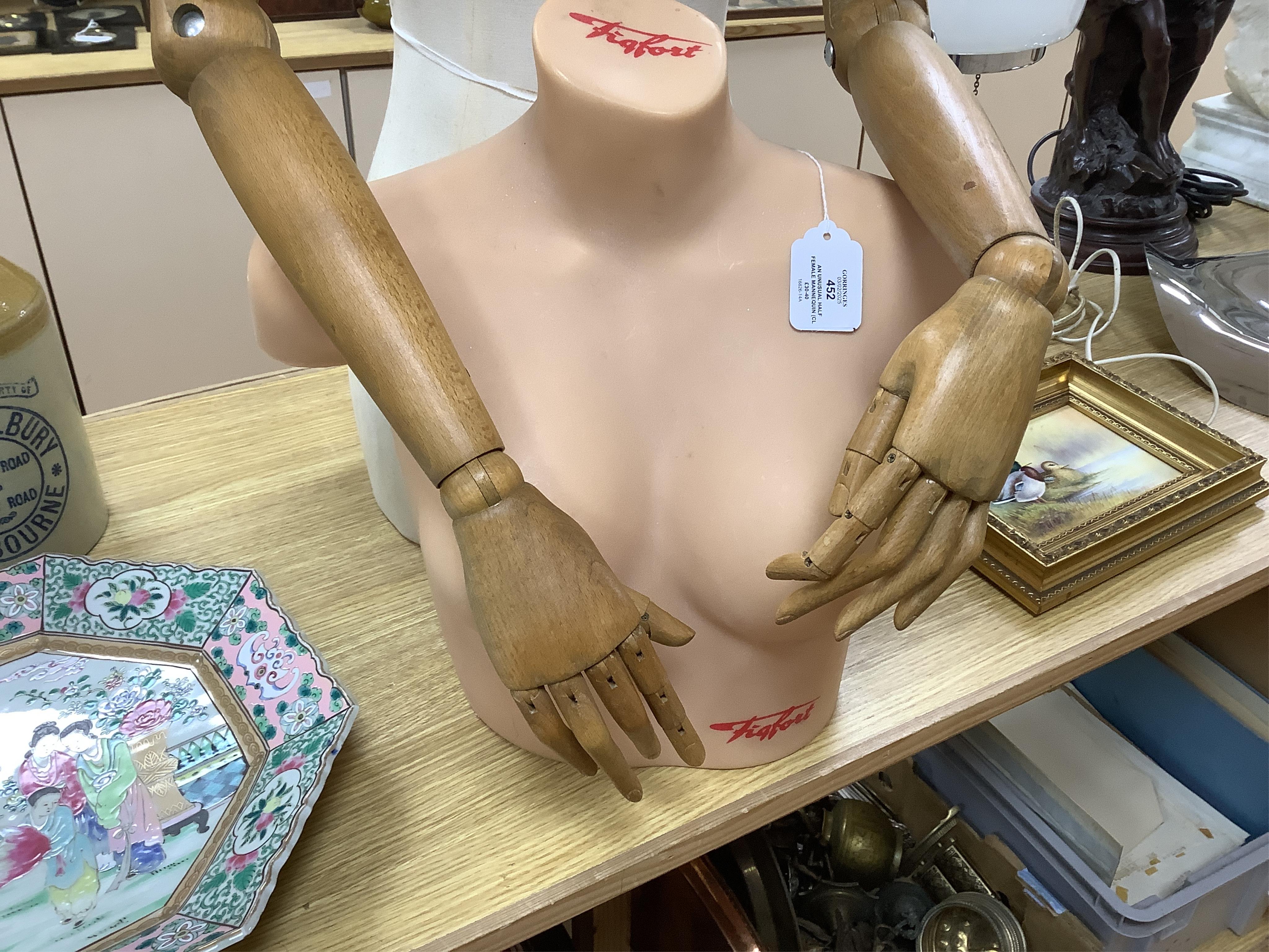 An unusual half female mannequin (cloth covered) with carved wooden jointed arms, hands and fingers, together with a female bust, by Figfort, mannequin 72 cm high. Condition - both good